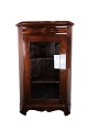 The antique 
Late Empire 
corner cabinet 
with mahogany 
shelves from 
the 1840s is an 
impressive ...