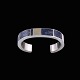 Sørresiig - 
Denmark. 
Sterling Silver 
Bangle with 
Sodalite and 
14k Gold.
Designed and 
crafted by ...