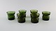 Jens Harald 
Quistgaard. 
Eight "Hygge" 
light holders 
for teacandles 
in dark green 
art glass. ...