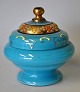 Art deco 
bonbonniere in 
light blue 
glass, approx. 
1920. With 
enamel 
decorations and 
gildings. ...