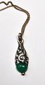 Pendant in 
silver with 
green stone and 
chain, A / S 
Karat (after 
1944), 
Copenhagen, 
Denmark. ...