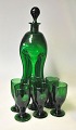 Green bottle 
with 6 glasses. 
20th century 
Denmark. Height 
bottle: 27 cm. 
Height of 
glass: 8 ...