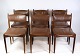 A set of 6 
chairs of 
Danish design 
made of solid 
rosewood with 
brown leather 
from around the 
...