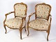 A pair of 
neo-rococo 
armchairs with 
decorative 
light wood 
fabric from 
around the 
1930s is a ...