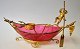 Bohemian glass 
boat, in the 
shape of a 
Venetian 
gondola, 
ca.1900. 
Raspberry 
coloured glass 
with ...
