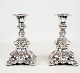 A pair of real 
silver 
candlesticks in 
the Rococo 
style from 
around the 
1930s
Dimensions in 
cm: ...