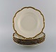 KPM, Berlin. 
Six Royal Ivory 
deep plates in 
cream-colored 
porcelain with 
gold 
decoration. ...