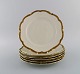 KPM, Berlin. 
Six Royal Ivory 
dinner plates 
in 
cream-colored 
porcelain with 
gold 
decoration. ...