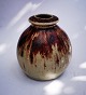 Vase in ceramic 
by Jesper 
Packness from 
his own studio. 
artly covered 
by red oxeblod 
glaze. ...