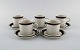 Anja 
Jaatinen-
Winqvist for 
Arabia. Five 
Karelia coffee 
cups with 
saucers in 
glazed 
stoneware. ...