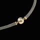 Ole Lynggaard. 
Necklace with 
14k Gold Ball 
Clasp.
Sterling 
Silver Wire 
Necklace with 
18k Gold ...