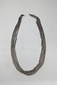 Ole Lynggaard 
Sterling Silver 
/ 18K Gold 
Necklace 7 
stringed 
Measures 40 cm 
(15.75 inch) 
Vægt 38 ...