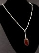 N E From 
sterling silver 
necklace 46.5 
cm. with amber 
subject no. 
506059