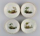 Four antique 
Royal 
Copenhagen 
porcelain bowls 
with 
hand-painted 
landscapes and 
gold 
decoration. ...