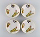 Royal 
Worcester, 
England. Four 
Evesham 
porcelain bowls 
decorated with 
fruits and gold 
rim. ...