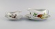 Royal 
Worcester, 
England. Two 
Evesham sauce 
jugs with 
saucers in 
porcelain 
decorated with 
fruits ...