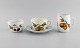 Royal 
Worcester, 
England. 
Evesham 
porcelain 
morning cup 
with sugar bowl 
and cream jug 
decorated ...