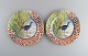 Gien, France. 
Two Savane 
porcelain 
plates with 
hand-painted 
exotic birds. 
Late 20th ...