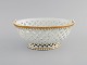 Antique Meissen 
bowl in 
openwork 
porcelain with 
hand-painted 
gold 
decoration. 
19th ...