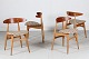 Hans J. Wegner 
(1914-2007)
Set of 4 
chairs CH 33 
made of solid 
oak and teak
upholstered 
with ...