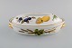 Royal 
Worcester, 
England. 
Evesham lidded 
dish in 
porcelain 
decorated with 
fruits and gold 
rim. ...