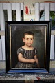 Decorative, 
small 1800s 
children's 
portrait 
painting, oil 
on canvas in a 
black wooden 
frame. The ...