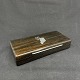Length 21 cm.
Width 10 cm.
Box in dark 
bog oak with 
inlay on top 
depicting 
Greenland and 
the ...