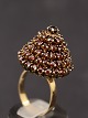 14 carat gold 
ring size 57-58 
with numerous 
garnets weight 
9 grams item 
no. 515088