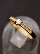 14 carat gold 
ring size 55 
with one 
diamond 0.10 
carat and 10 
small diamonds 
item no. 515521