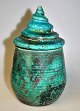 Danish 
ceramicist 
(20th century) 
Lidded jar. 
Raku. With 
turquoise/luster 
glaze. Lid 
designed as ...