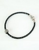 Pandora black 
braid bracelet, 
stamped 925 
sterling with 
original 
pandora lock.
Slide: 6
