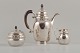 Rare Georg 
Jensen coffee 
pot with 
matching 
creamer and 
sugar bowl in 
sterlingsilver 
and ...