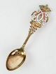 Jubilee spoon 
by A. Michelsen 
in gilded 
sterling silver 
decorated with 
white and red 
enamel on ...