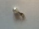 Pendant/Charms 
with Pearl in 
14 carat gold
Stamped 585
Height 15.13 
mm approx
checked by ...