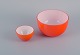 Piet Hein for 
Holmegaard. 
Danish design.
Two orange art 
glass bowls.
Late 1900s.
In perfect ...