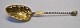 Serving spoon 
with clam 
shell, 1963, 
Denmark. 
Signed: FK. 
Twisted shaft. 
Gilded laf. L.: 
18 cm.