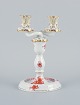 Herend, 
Hungary, 
two-armed 
porcelain 
footed 
candlestick, 
hand-painted 
with orange 
flowers.
Mid ...