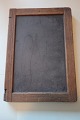 An old 
blackboard/slate 
mad of slate 
with an edge of 
wood
In a good 
condition
Articleno.: 
2-41331
