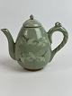 Small Korean 
teapot with 
green cracked 
celadon glaze 
with cranes and 
clouds. 
Height ...