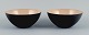 Two "krenits" 
bowls in metal.
Beige.
Design by 
Hermann 
Krenchel.
The 2000s.
In perfect ...
