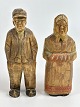 Pair of 
handmade, 
Danish wooden 
figures of a 
woman with a 
scarf and a man 
with a cap, 
circa ...