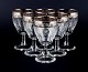 Murano, Italy, 
six mouth-blown 
and engraved 
port wine 
glasses with 
silver rim.
Mid 20th ...