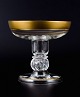 Rimpler 
Kristall, 
Zwiesel, 
Germany, mouth 
blown crystal 
champagne glass 
with gold rim 
decorated ...