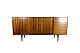 The sideboard 
in rosewood, 
designed by 
Henry Rosengren 
Hansen and 
produced by 
Brande ...