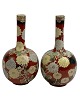 Pair of nice 
Asian vases, 
presumably 
Japanese. 20th 
century. Iron 
glaze with 
flowers. ...
