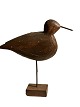 Sculptural and 
decorative bird 
decoy carved 
from wood and 
standing on a 
wooden stand. 
...
