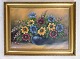 Painting on the 
canvas in a 
gold frame of 
floral motifs 
in yellow and 
blue colors 
from around ...