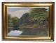 Painting on 
canvas in gold 
frame of lake 
and forest from 
around the 
1930s. Signed 
Th ...