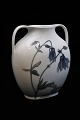 Royal 
Copenhagen Art 
Nouveau vase 
with handle and 
decorated 
flower branch. 
H:17cm. W:15cm. 
...