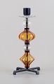 Erik Höglund 
for Kosta Boda. 
Tall 
candlestick 
holder made of 
mouth blown 
glass and cast 
...